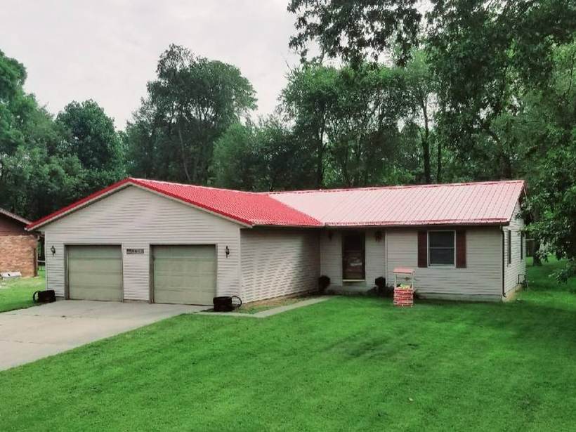 Steel Master Roofing install: Exposed Fastener, Rustic Red
