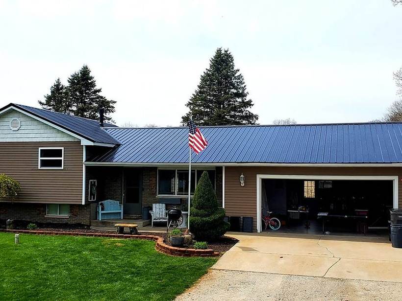 Steel Master Roofing install: Battenlok Siding