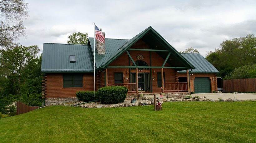 Log home in Warsaw, Indiana with a finished metal roof