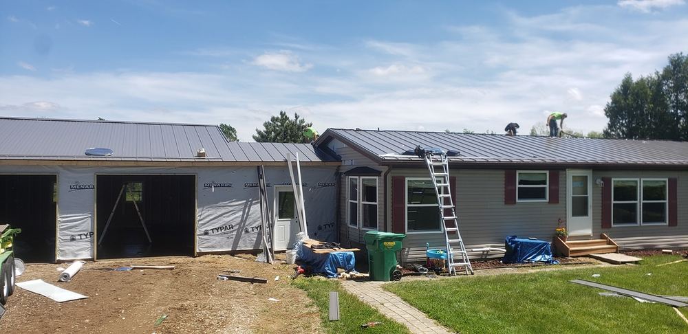Steel Master Roofing install: Standing Seam - regal red
