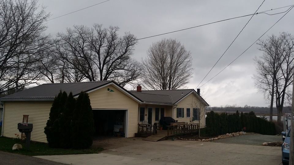 Steel Master Roofing install: edwardsburg - Before After