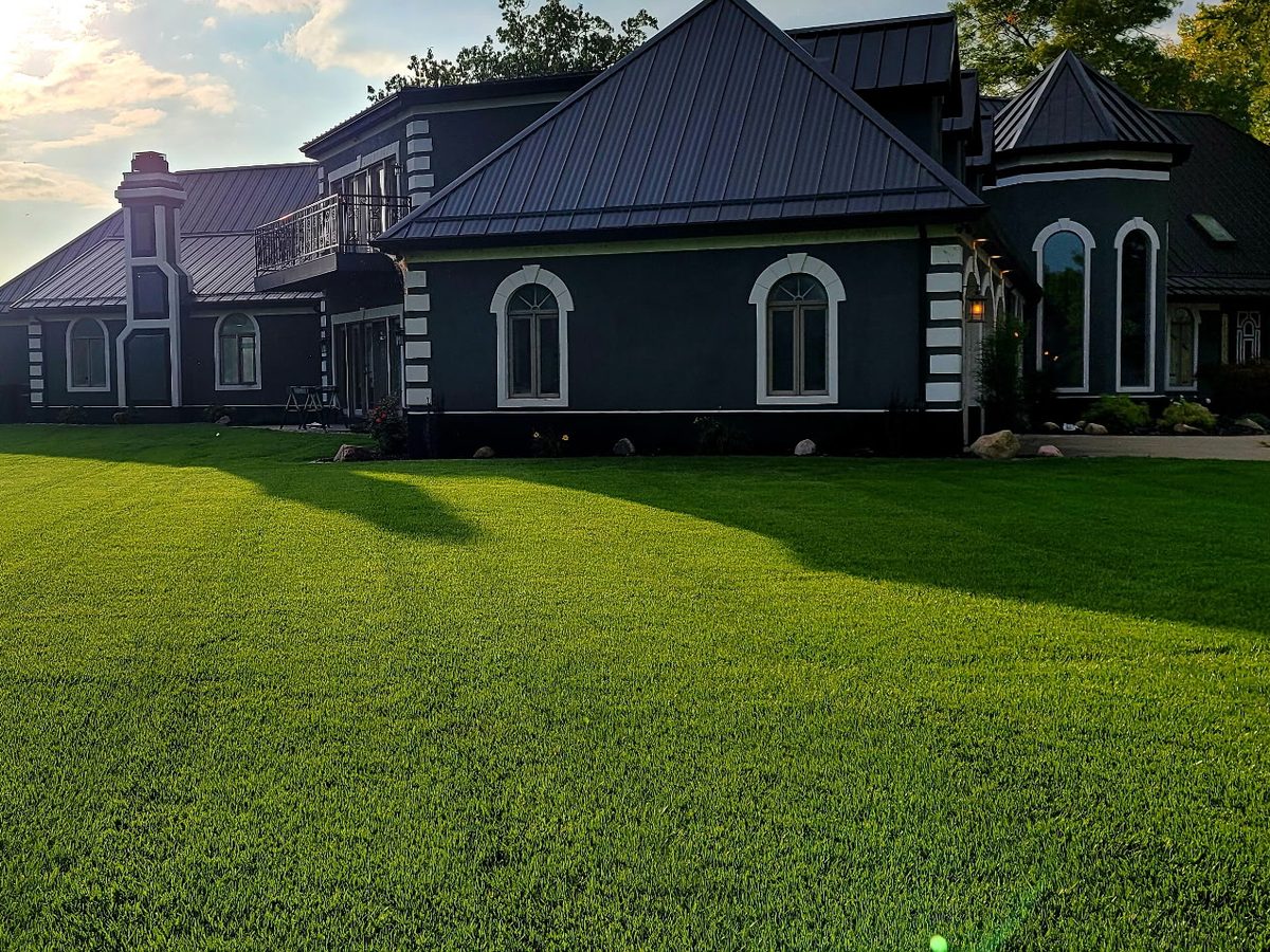 Masterlok Lifetime 150 standing seam metal roof in charcoal on a lakefront home in Michiana